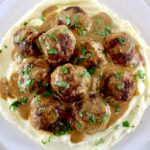 Keto Swedish Meatballs over cauliflower mash with parsley on top