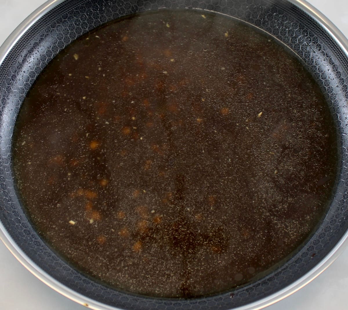 beef broth in skillet