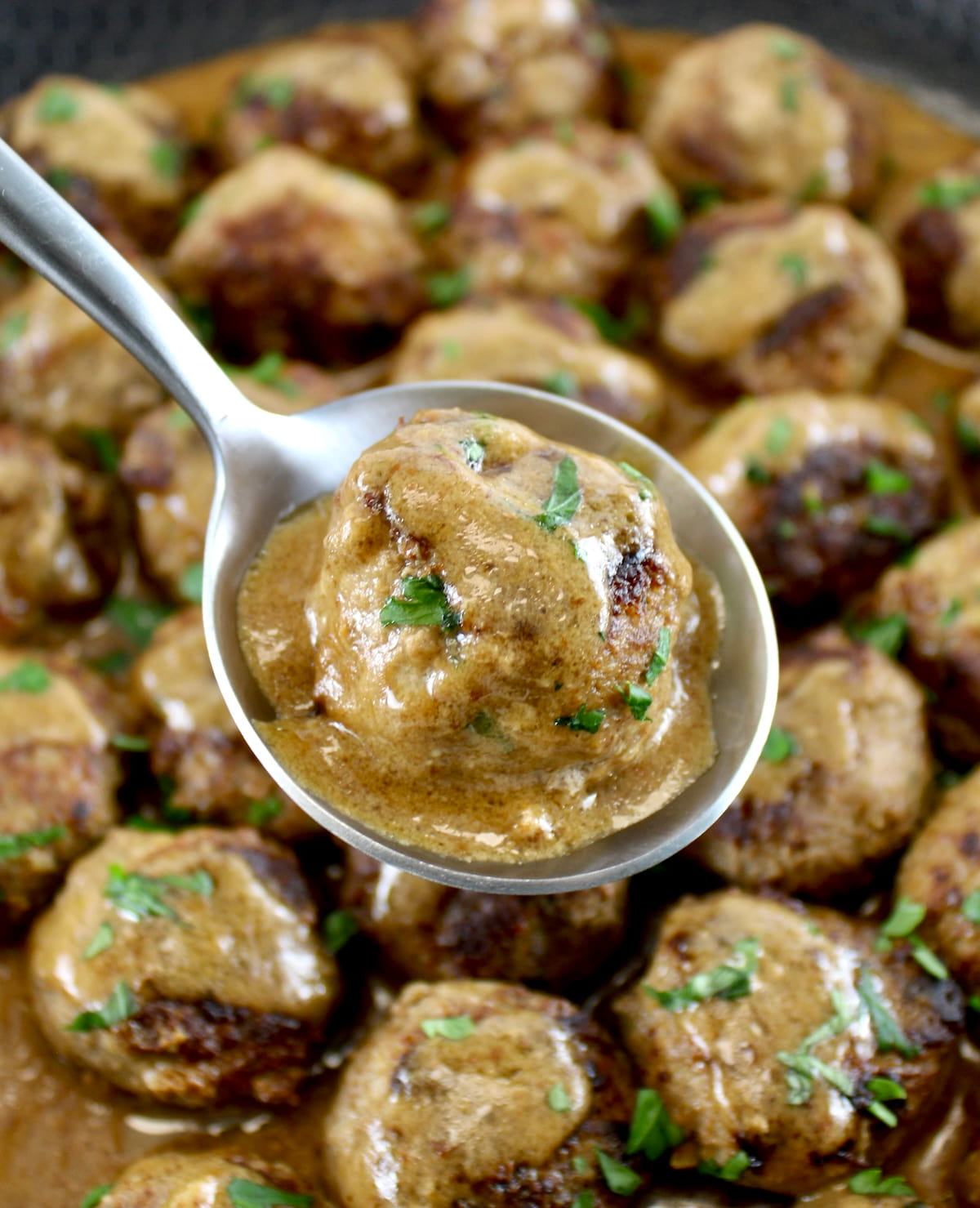 holding up Keto Swedish Meatball in spoon