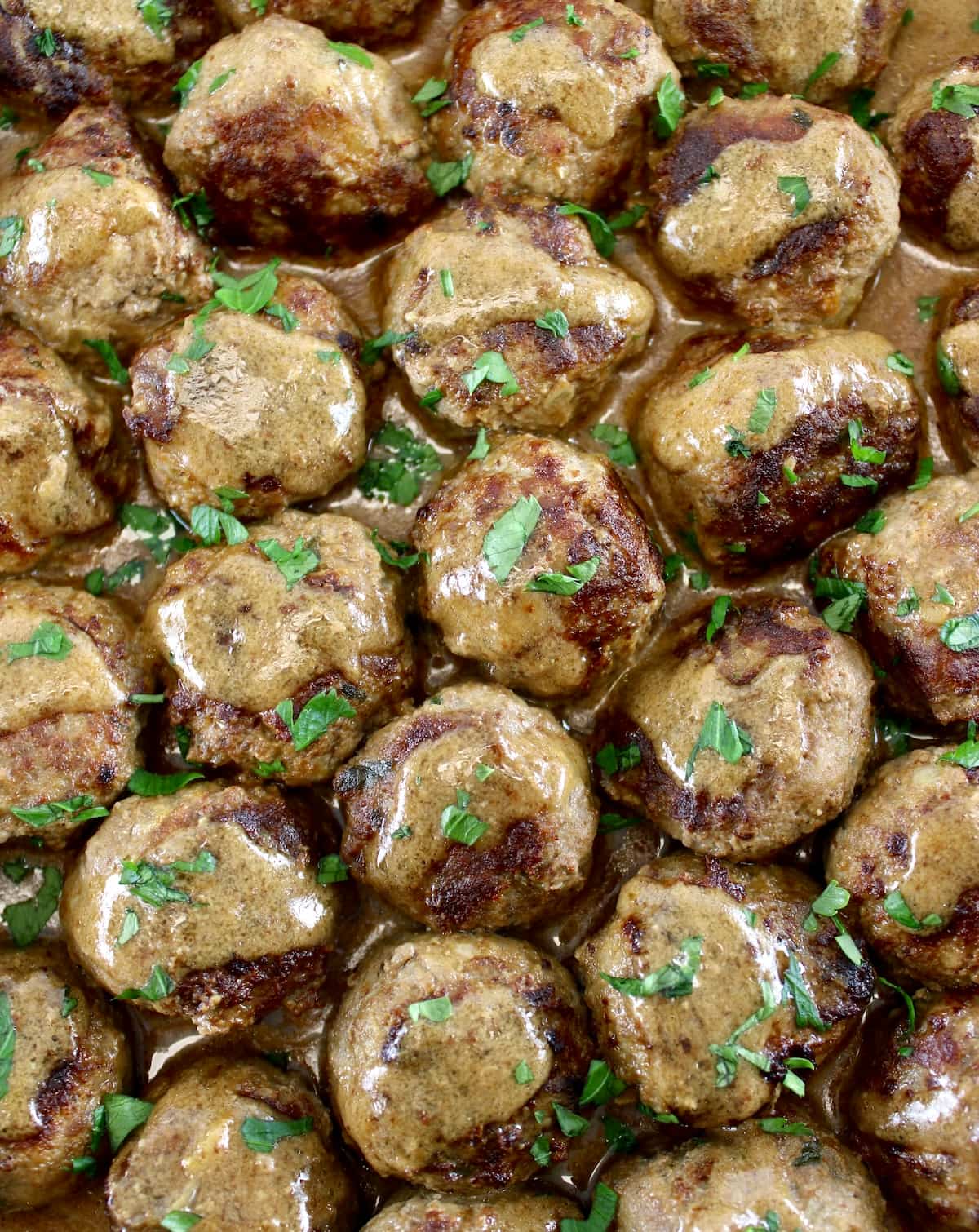 overhead view of Keto Swedish Meatballs with chopped parsley