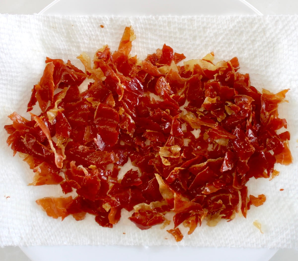 crumbled crispy prosciutto on paper towels