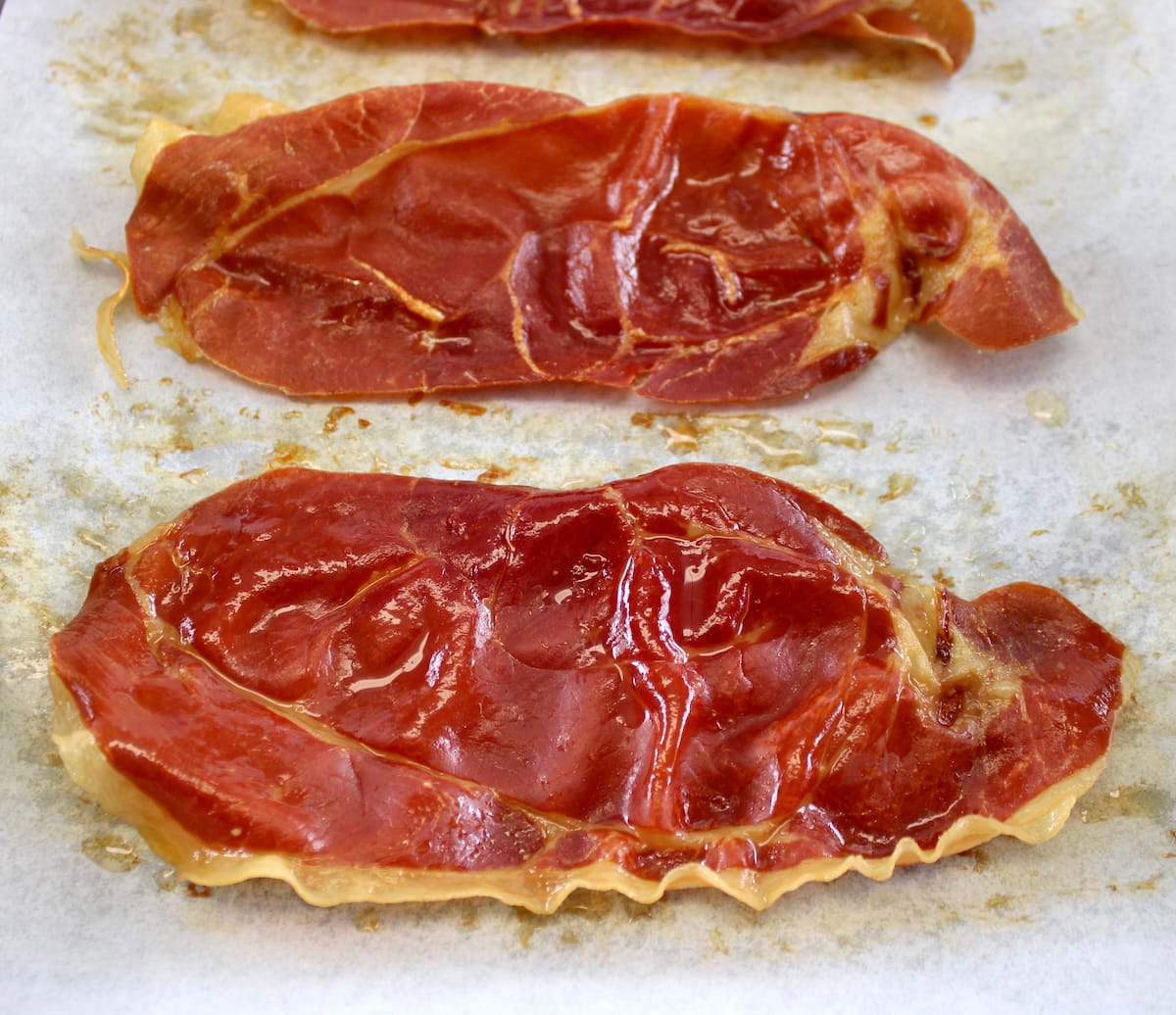 crispy baked prosciutto on parchment paper